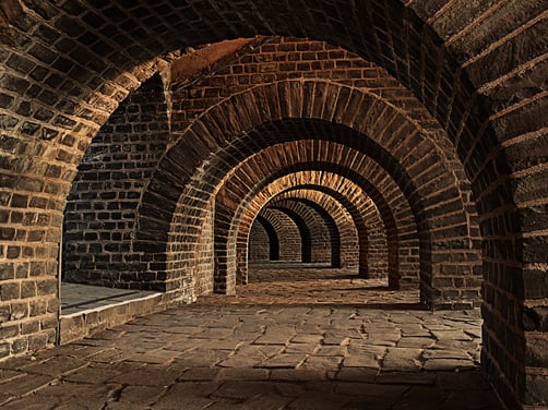 Vaulted ceiling walkway in old building
