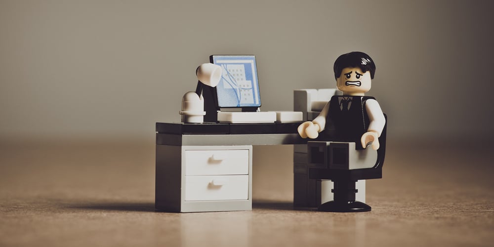 Stressed Lego man at desk
